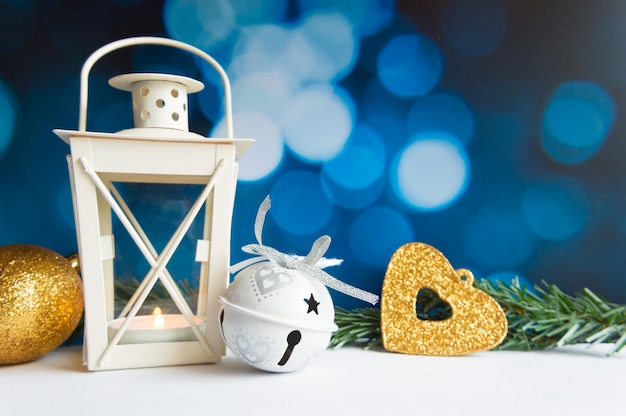 Christmas ball tree and lantern on blue bokeh light background