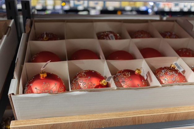 Christmas balls on the Christmas tree in the supermarket Christmas balls in a box