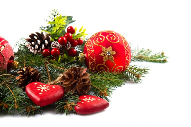 Christmas balls and fir branches with decorations isolated over