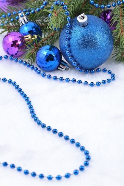 Christmas balls and garland on a spruce branch for decoration