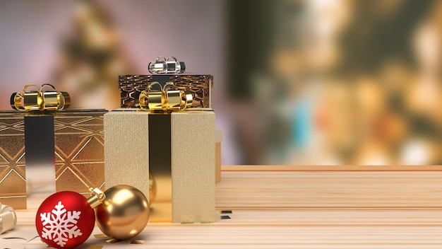 The Christmas balls and gift box on wood table for holiday concept