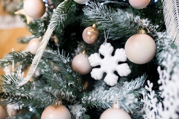 Christmas balls and toys on the Christmas tree Christmas decorations and white decor