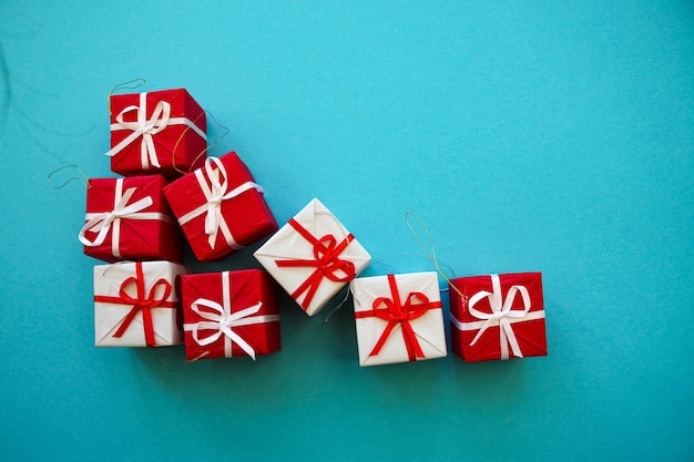 Christmas banner with white and red gift boxes on blue background