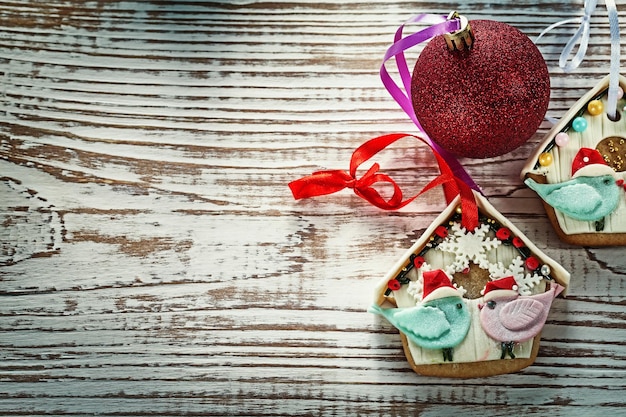 Christmas bauble gingerbread cookies on vintage wooden board