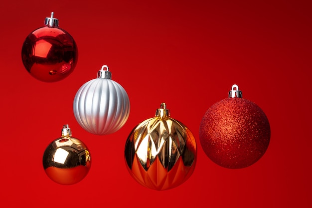 christmas bauble over red background