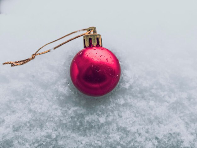 Christmas bauble in the snow single red bauble