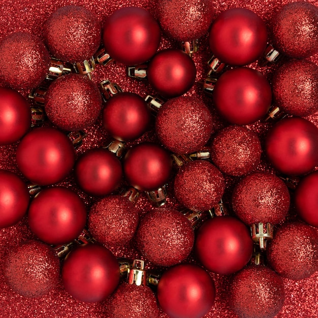 Christmas baubles on a red glittering background