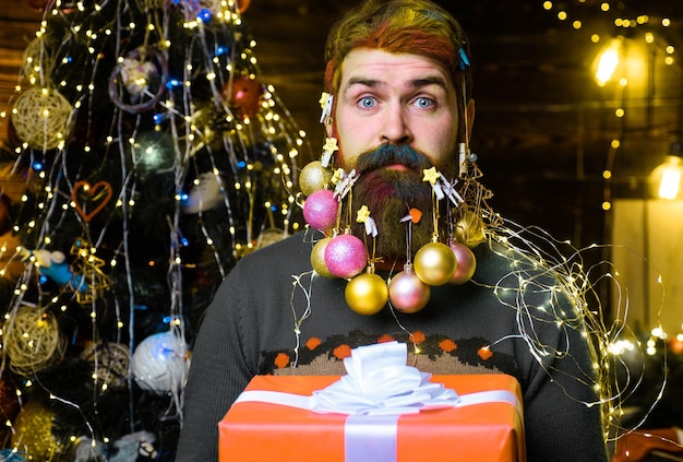 Christmas beard decorations surprised bearded man with present gift box new year holidays