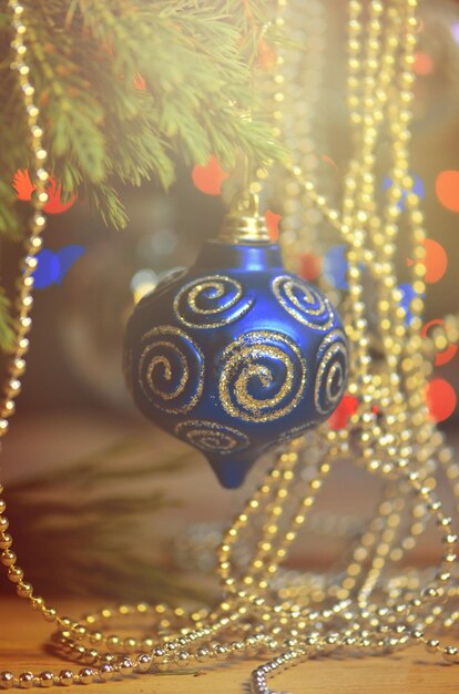 Christmas blue ball on branches fir Christmas tree branch and blue ornament