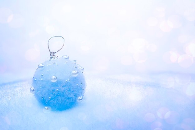 Christmas blue ball in the snow In Snowing Background