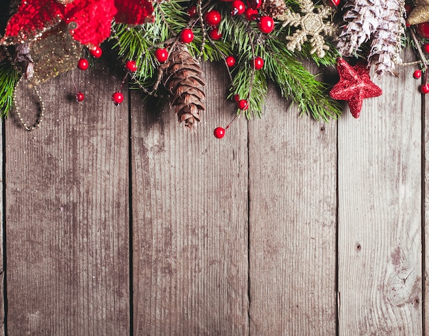 Christmas border design on the wooden background