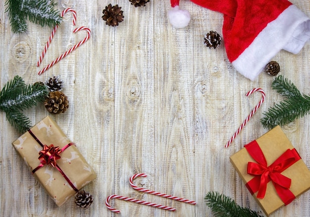 Christmas box of New Year's toys on a wooden background.