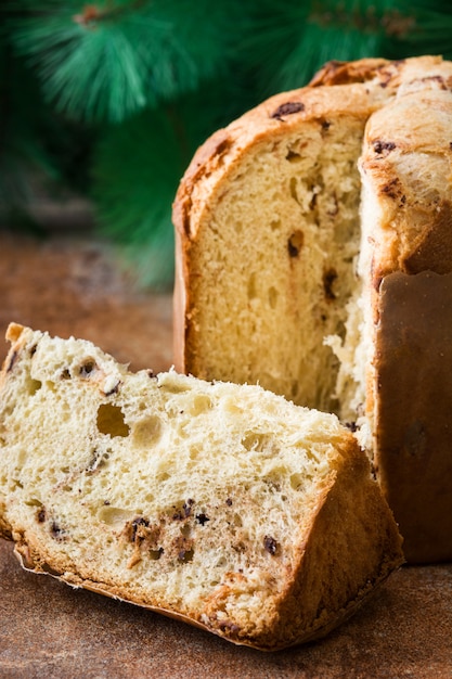 Christmas cake panettone and Christmas decoration on wooden