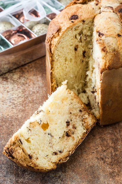 Christmas cake panettone on a rusty wooden