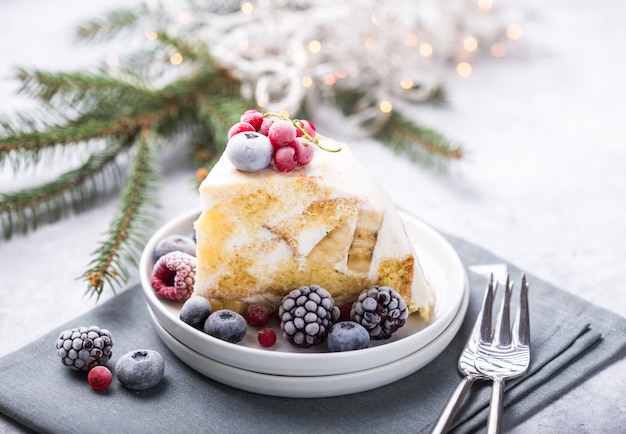 Christmas cake with cranberries and Christmas decorations