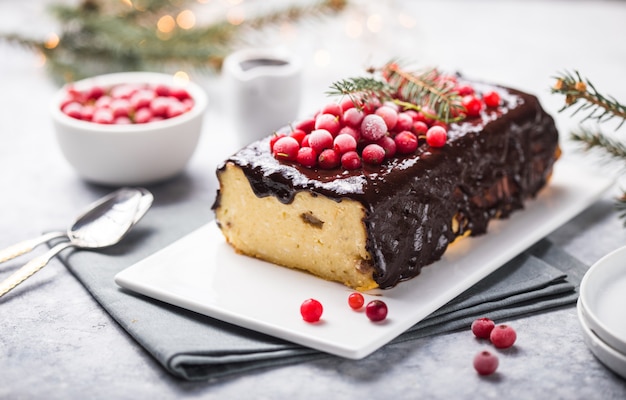 Christmas cake with cranberries and Christmas decorations