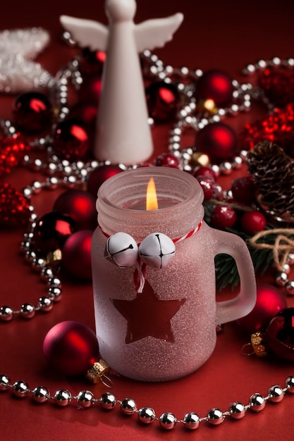 Christmas candle in a glass jar and other decorations