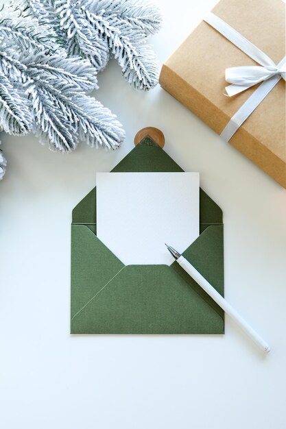 Christmas card flat lay Modern greeting card mock up composition with christmas decorations on white background Empty postcard template with space for text Merry Christmas and Happy Holidays