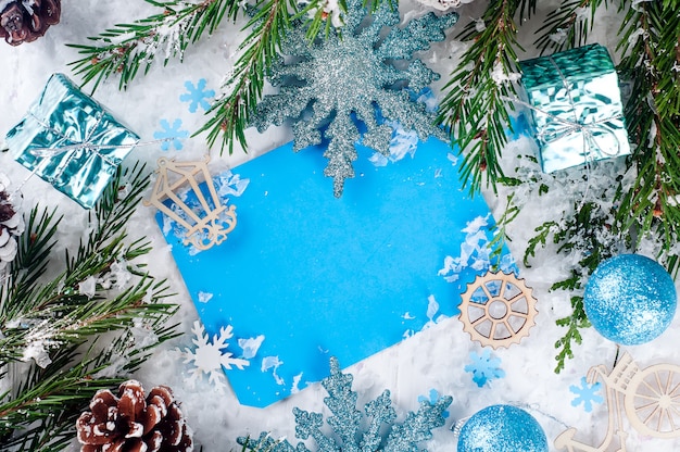 Christmas card with decorated fir tree on snow.