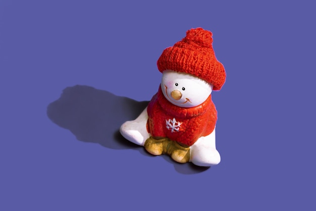 Christmas cheerful snowman on the backdrop of the trendy 2022 color