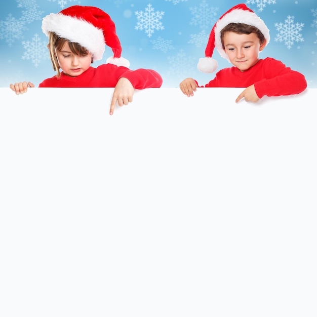 Christmas children kids Santa Claus pointing empty banner square snow copyspace