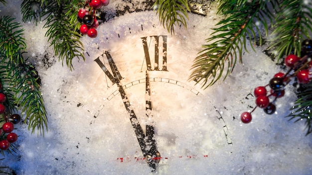 Christmas clock and decoration on snow Happy new year concept