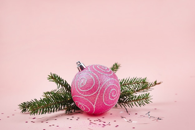 Christmas composition. Christmas pink decorations in pastel pink tones, copy space