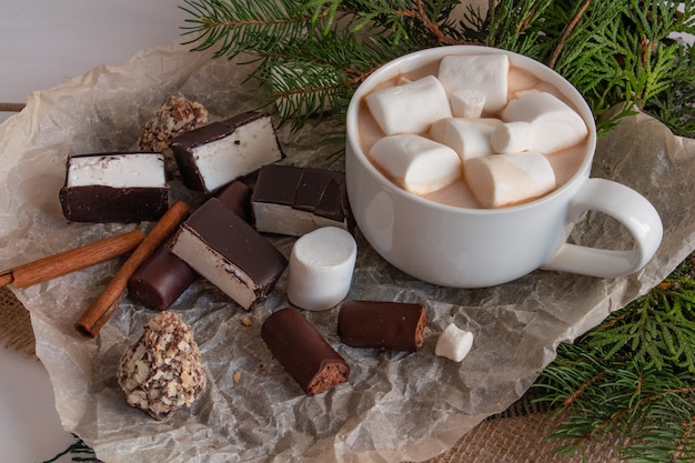 Christmas composition cocoa with marshmallows branches of a Christmas tree sweets