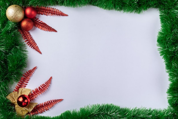 Christmas composition Decorations with red and gold Christmas balls on white background Top view copy space