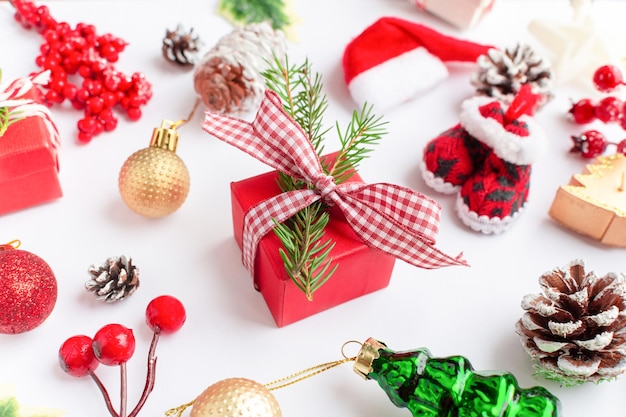 Christmas composition flatlay Christmas gifts red and gold fir branches and red berries