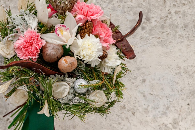 Christmas composition of flowers and Christmas decorations closeup