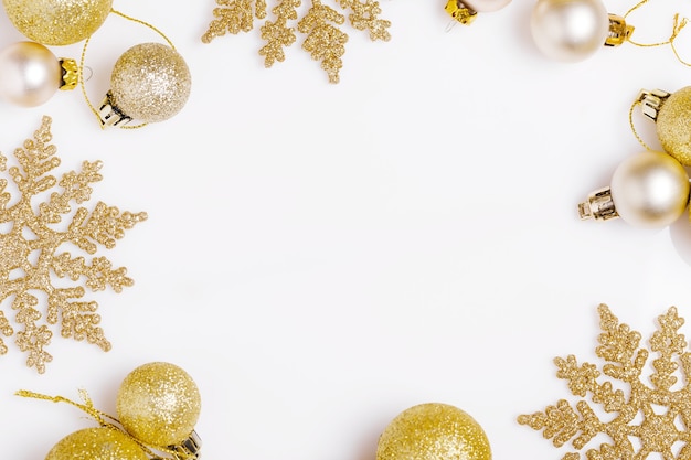 Christmas composition. Golden christmas gift, thuja branches and ribbon. Flat lay, top view