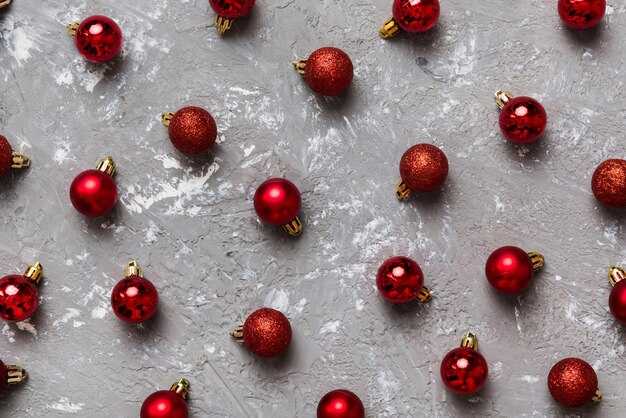 Christmas composition a pattern of christmas balls on colored background Flat lay top view New year decor