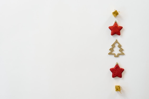 Christmas composition. Pattern with Christmas tree toys on a white background. Flat position, top view, copyspace