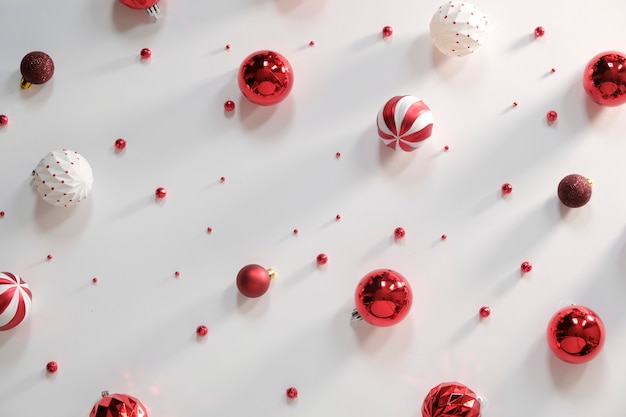 Christmas composition - red decorations on white background. 