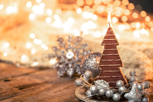 Christmas composition with a candletree and details of a festive decor