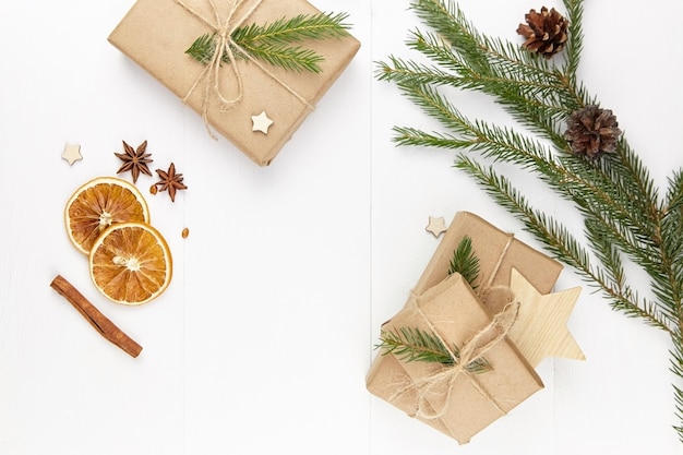 Christmas composition with gift boxes and wooden stars on white