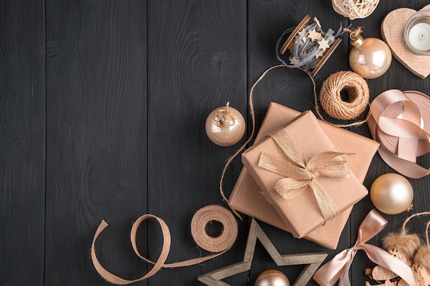 Christmas composition with gifts and toys in golden and beige colors. Top view, copy space.