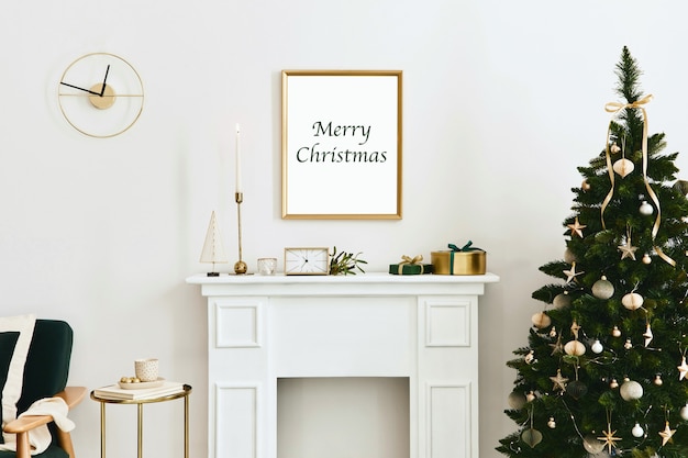 Christmas composition with gold mock up poster frame, white chimney and decoration. Christmas trees and wreath, candles, stars, light and elegant accessories. Template.