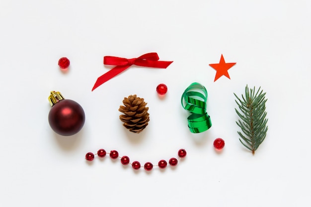 Christmas composition with green and red small objects