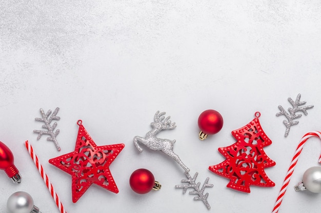 Christmas composition with red and silver gifts on stone background. Xmas holiday 2021 celebration. Flat lay, top view, copy space - Image