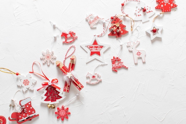 Christmas composition with red and white Christmas tree ecotoys on a white background