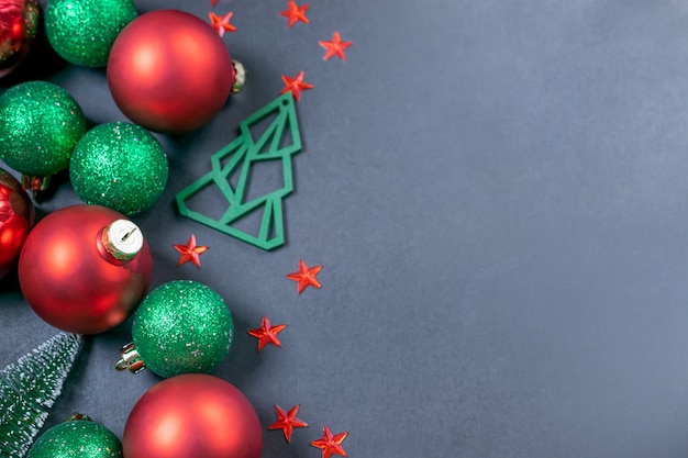 Christmas composition with shiny green and red Christmas balls