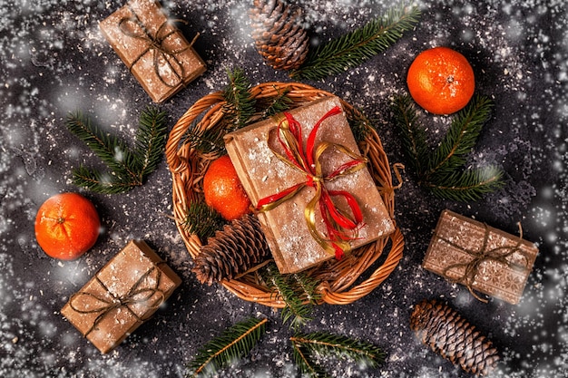 Christmas composition with tangerines gift boxes cones