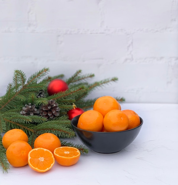 Christmas composition with tangerines on white background. Space for text