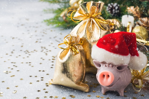 Christmas composition with toys, piggy and branches