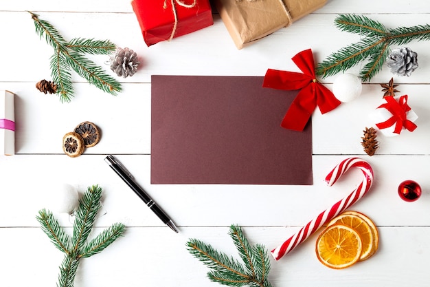 Christmas composition on wooden white background