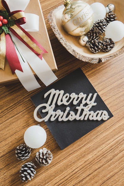 Christmas concept with Christmas decorations on wood background.