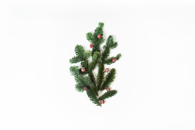 Christmas concept with green branches of fir tree with christmas balls