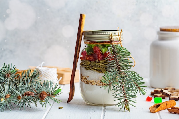 Christmas cookie mix jar. Dry ingredients for cooking Christmas cookies in a jar, white background.